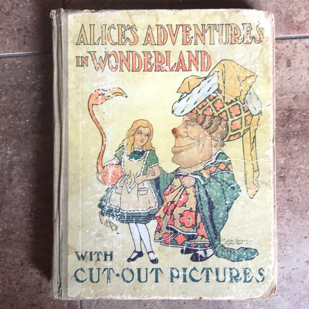 Alice in Wonderland book with cut out pictures